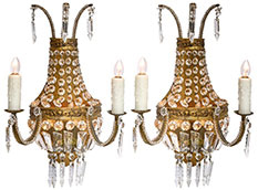 These Fabulous French Antique Crystal Sconces In The Style of Louis XVI Are Made Of Finely Cast Gilted Bronze And Features An Array Of Crystal Pendants. Circa 1920. This Pair Has Been Newly Rewired to Fit US Standards. You Can Find This Neoclassic Pair and Many More Vintage Sconces At Jean-Marc Fray Antiques in Austin, TX. We Also Ship Worldwide.