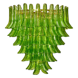 Green Murano glass “Selle” chandelier with stunning pieces overlapping to create a feathered effect. This stunning work of art, from the artisans in Murano, Italy, created this piece out of green glass with hand-blown techniques through each piece. The fixture requires 10 medium-base bulbs up to 60 watts each and is wired to meet US standards. Current height from ceiling: 64"