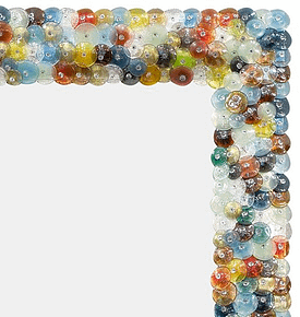 Murano glass “coriandoli” mirror made of hand-blown glass pieces or “pastille” in a variety of colors. The name “coriandoli” means confetti. We love the beautiful detail of this piece. Add some color into your space with this colorful murano glass mirror. Elegant and fun.