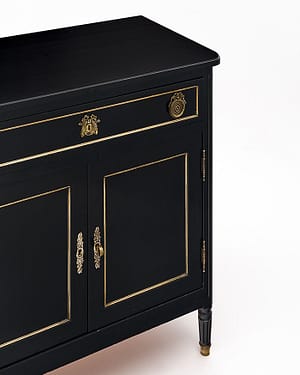 Buffet, French, from the Rhone Valley. This piece is made of mahogany that has been ebonized and finished in a lustrous museum-quality French polish. There are two doors that open upon adjustable shelving. One dovetailed drawer for functionality and beautiful gilt brass trim and hardware throughout.
