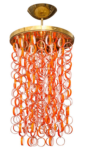 Italian Chandelier from the iconic Vistosi Studio on the Island of Murano. This piece features multiple strands of Murano tangerine and white rings hanging from a solid polished brass structure. Boldness and color added with Murano Glass Chandelier.