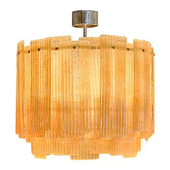 Italian Murano Glass Chandelier. Made on the Island of Murano, this italian chandelier features graniglia glass blades hung on a brass structure. This Graniglia Chandelier offers a soft glow.