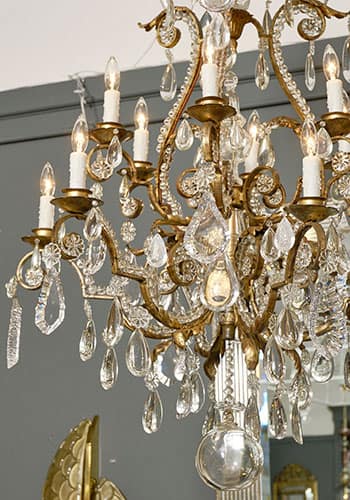 French Antique Baccarat Crystal and Gold Chandelier. This chandelier features hand hammered iron and gold leafed structure. With a large array of shape and sizes of crystals. Circa 1910 from Nice, France