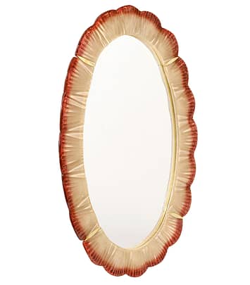 Murano glass mirror by Fuga. This Italian piece is made of red and pink hand-blown glass elements. Each component showcases the striking color combinations of Murano and the superior craftsmanship. The lovely glass is held accented by brass details. We love the oval shape and texture of the glass. Add boldness to your home with a dash of Murano Glass Color