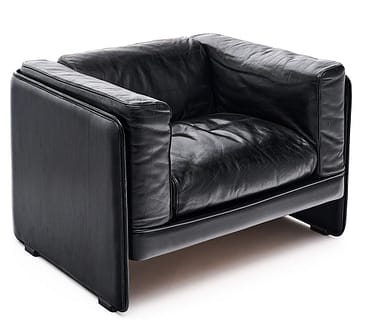 Leather armchair of black leather by Poltrona Frau. Poltrona Frau continues to produce high quality leather products.