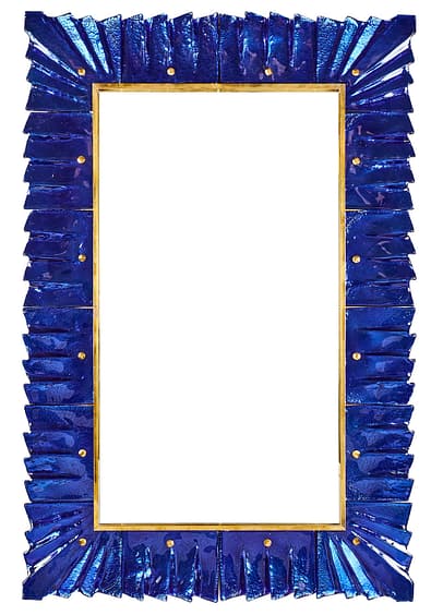 Spectacular mirror of Murano cobalt blue glass and brass. We can't resist the thick deep blue glass components that form the frame attached with round brass nuts. Add vibrant blue to your home.