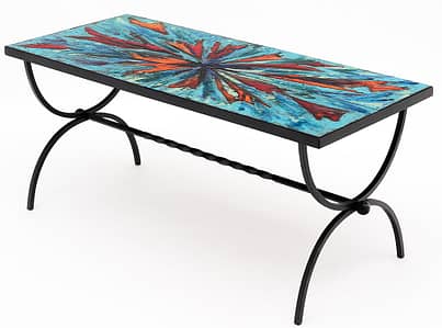 Coffee table from Vallauris on the French Riviera. This piece has a structure of hand-hammered forged iron. It is covered with thick terra-cotta hand painted tiles with an abstract motif in vivid colors. Add some vivid color into your space with a coffee table. 
