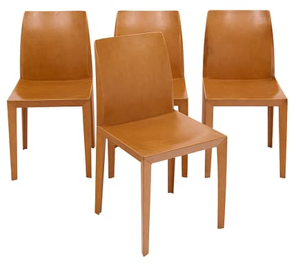 Set of four chairs in the Italian Modernist style by iconic company “Poltrona Frau”. This set is fully lined with fine tan colored leather. Poltrona Frau is an iconic italian designer.