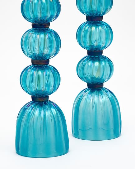 Pair of lamps from Murano, Italy made of hand-blown blue iridescent colored glass. They have been newly wired to fit US standards. Add beautiful blue to your home.