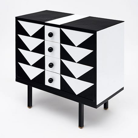 Chest of drawers, Italian, from the Veneto region, this nicely proportioned Italian vintage chest has been fully veneered with black and white slabs of Murano glass, it features four dovetailed drawers each with spheric black Murano glass pull. The elegant dynamic cabinet sits on its original black lacquered steel base. 