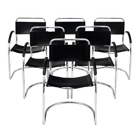 Mies van der Rohe Armchairs in chromed aluminum and black leather.
