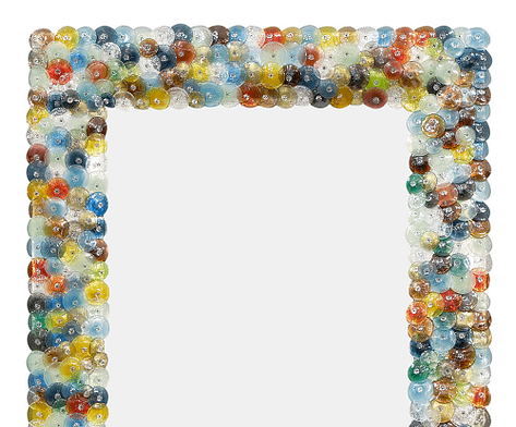 Murano glass “coriandoli” mirror made of hand-blown glass pieces or “pastille” in a variety of colors. The name “coriandoli” means confetti. We love the beautiful detail of this piece.