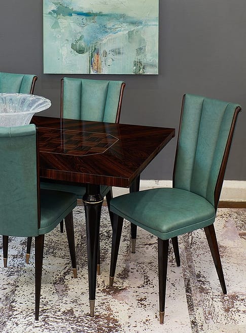 Teal French Mid-Century Modern Vinyl Upholstery Paired with a Macassar Wood Dining Table. Dining Room Interior. 