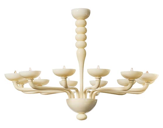 Italian ivory Murano glass chandelier with twelve branches. We love the classic lines and modern details of this hand-blown fixture. It has been newly wired to fit US standards and requires 12 candelabra base bulbs. The height from ceiling is 61".