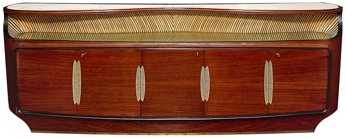 Grande Italian buffet/credenza made of rosewood finished in a lustrous French polish, by iconic Designer Osvaldo Borsani, the rounded side board boasts five doors opening to ample storage and bar. Gilt brass hardware, working locks and keys. Ebonized accents, marble top, professionally restored.