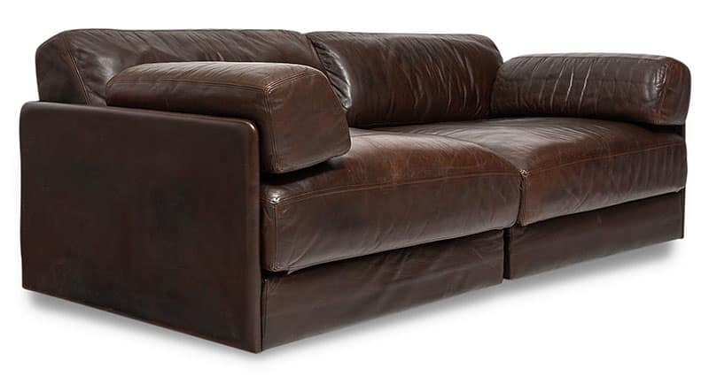 Sofa, from Switzerland, DeSede exclusive, Model DS 76; upholstered in thick brown leather hide. The sofa consists of two modules with sofa bed function. Normal signs of wear and patina.