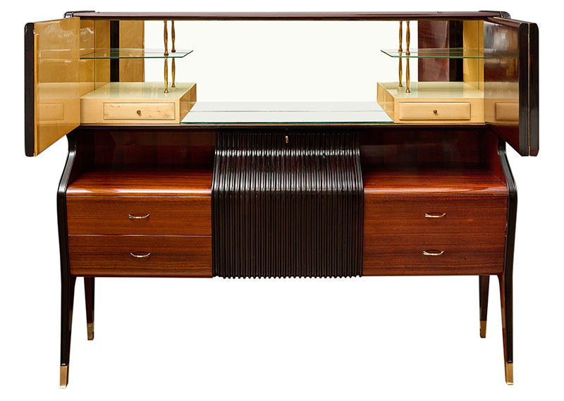 Italian rosewood buffet and bar by Italian designer Osvaldo Borsani. This fine cabinet features a mirrored and tinted glass upper compartment behind folding doors, on the bottom four dovetailed drawers separated by a ridged ebonized drop front. We loved the versatility of the piece and the exquisite craftsmanship.
