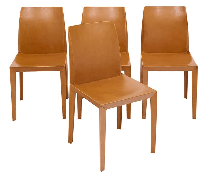 Set of four chairs in the Italian Modernist style by iconic company “Poltrona Frau”. This set is fully lined with fine tan colored leather.