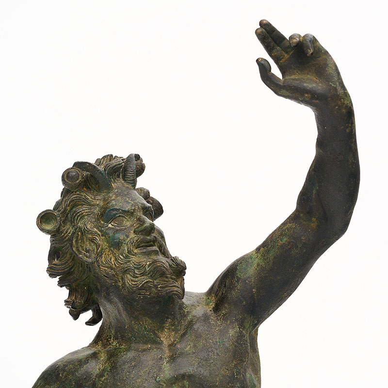 19th Century bronze statue depicting a faun signed “Chiurazzi Napoli” from the Chiurazzi foundry. Raised on a base of 10” by 11.25”, the figure shows a man with horns and tail. This piece has wonderful intricate detail. Chiurazzi foundries were established by Gennaro Chiurazzi senior (1840), the Neapolitan famous sculptor who first conceived and put in practice the idea of copying the ancient works of art in their splendour, drawing his inspiration from Cellini's method. Continuing their father’s work, Federico and Salvatore Chiurazzi continued until the Second World War. During this time, they began the marble works, the monumental foundry, the ceramics, the traditional foundry, and the foundry for copying of classic works. Unique to their foundry, Chiurazzi were the official foundry for antique reproductions, growing their customer base worldwide. The skill and techniques used by the foundry are only acquired through passing down from one generation to the 11 next, from father to son as the work continues.